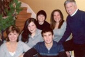 Photo of Amy and Alan Meltzer with family. Link to their story.